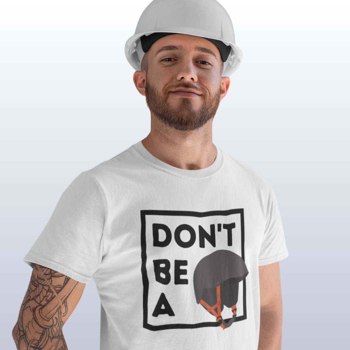 man wearing funny t-shirt which reads "don't be a helmet"
